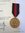 Medalla de la anexión de los Sudetes con documento