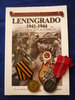 Lote nº9-Libro Leningrado 1941-1944, la División Azul en combate+2 medallas