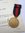 Medalla de la anexión de los Sudetes con documento